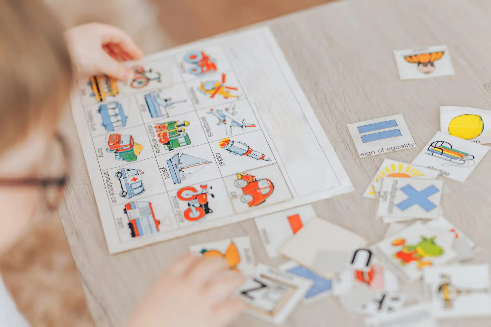 Young EFL ESL learner playing a game in the classroom