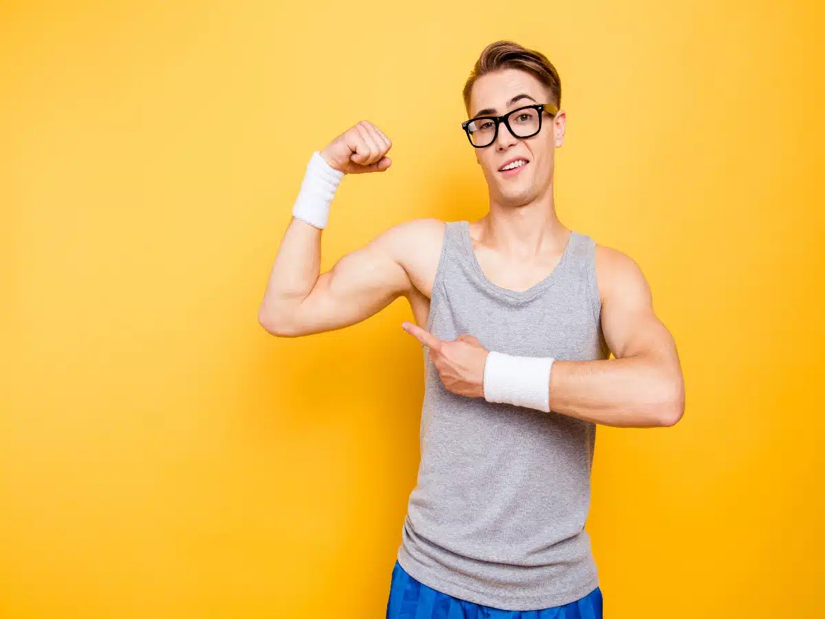 Young man showing off his muscles