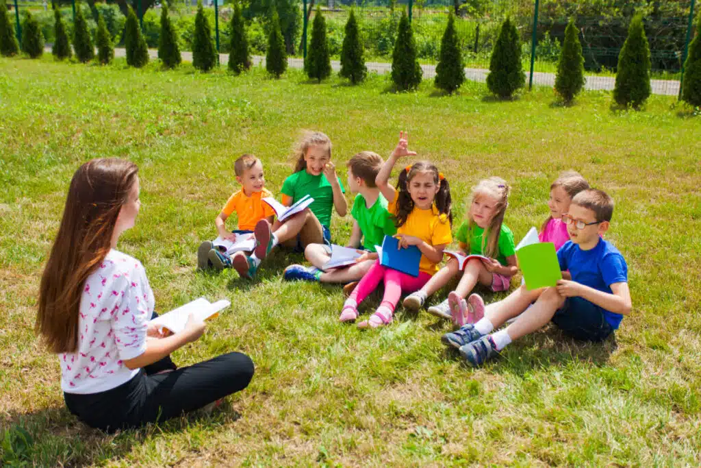 A TEFL teacher and learners on a summer camp in the UK