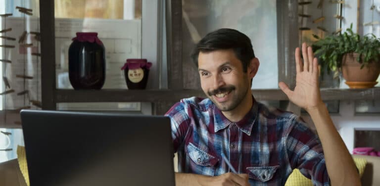man learns through a laptop in an online lesson on the Internet