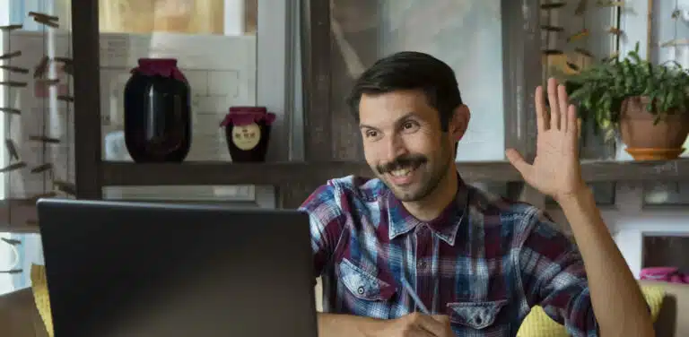 man learns through a laptop in an online lesson on the Internet