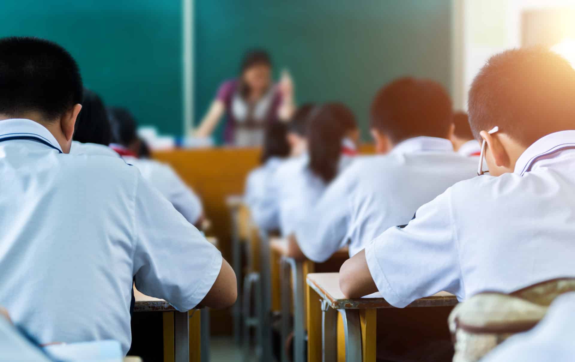 Students in a classroom. It's possible to teach English abroad without a degree in some countries.