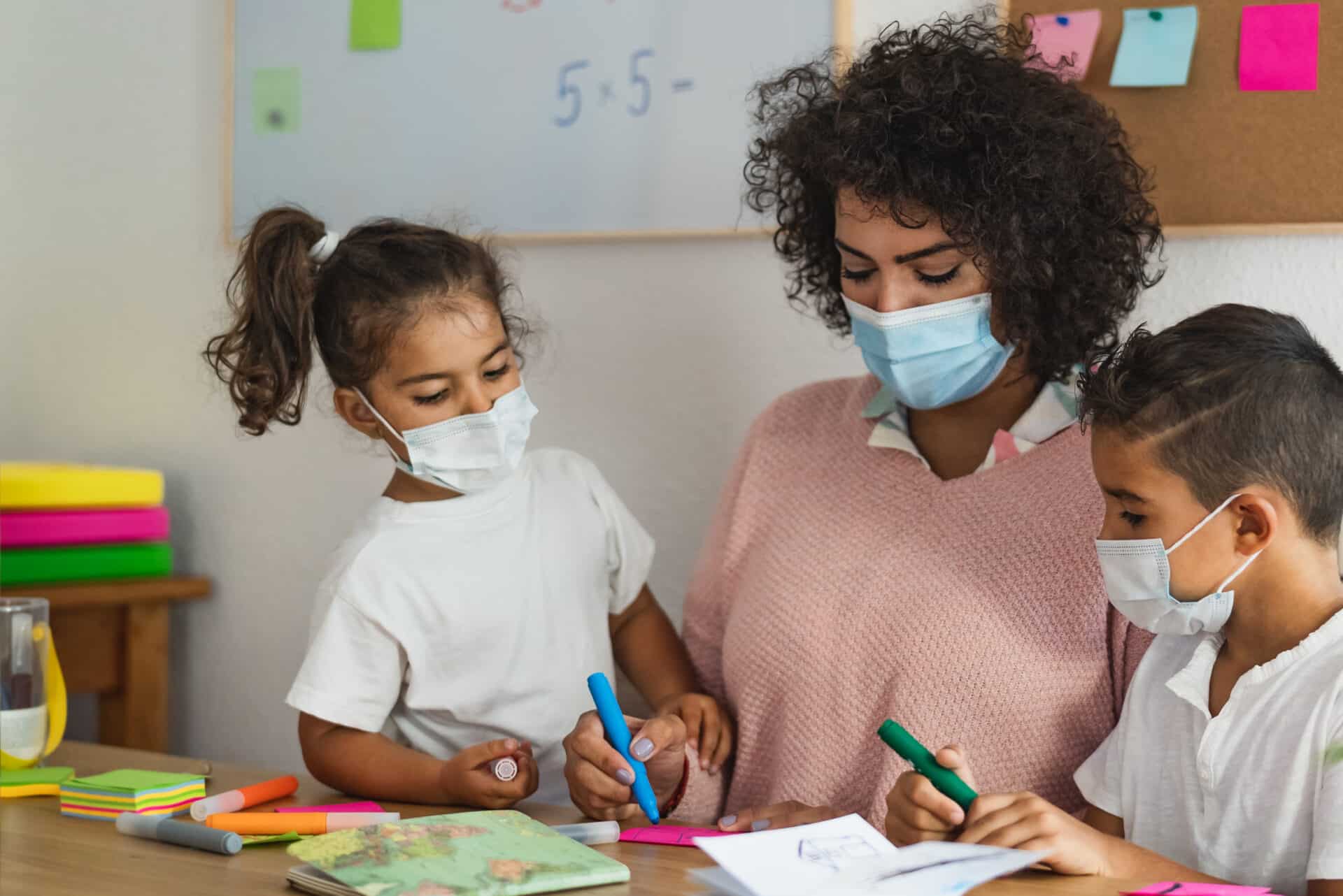 Student and teacher with Covid-19 masks