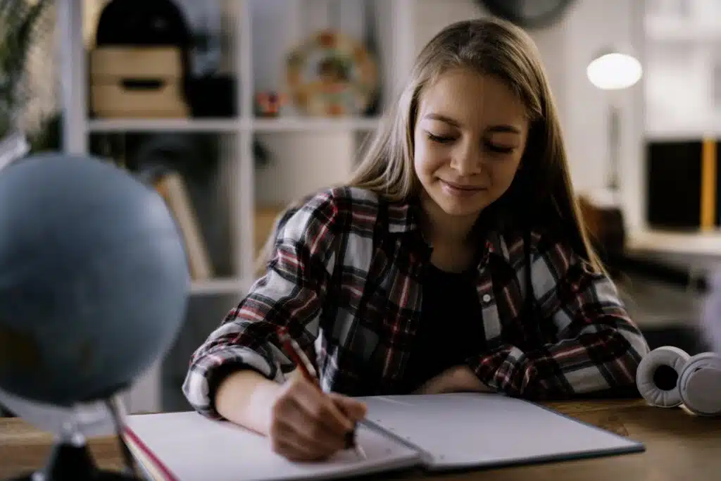EFL student sitting at a desk, doing work