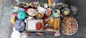 Local and tourist communicating without speaking the same language at a market