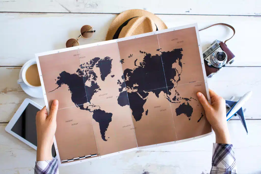 Travelling along as a woman: is it safe? Woman looks at map deciding where to go.