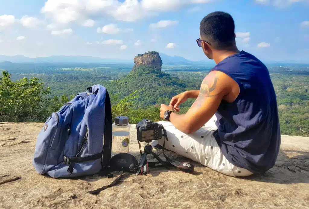 Man taking a rest while on a hike on holiday