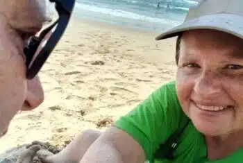 Natalie on the beach with her partner