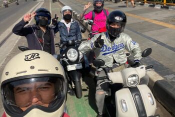 Teachers on motorbikes in Jakarta, Indonesia