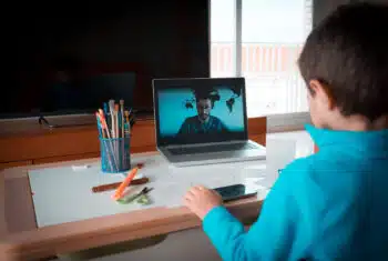 Boy at a laptop, having an online lesson