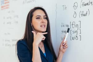 Teacher explaining the -th sound in English
