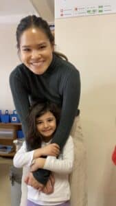 Teacher Perlie hugging a Turkish student