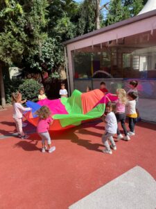 Kindergarten students play in the playground
