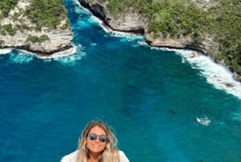 Taylor posing with a view of Bali behind her