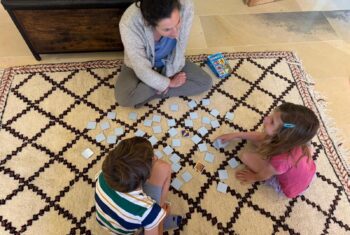 Teacher Rebekah playing a game with her Young Learner students