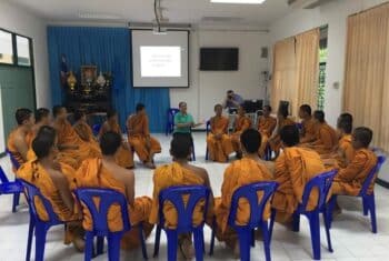 TEFL teacher teaching English to young Buddhist monks in a monastery classroom