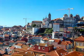 Panoramic view of Lisbon's orange rooftops, a popular digital nomad destination.