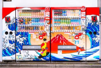 Row of colorful Japanese vending machines on a street in Tokyo selling drinks